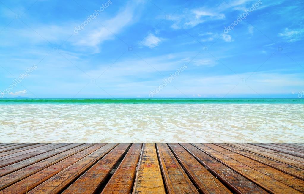 Beautiful beach with wooden plank Stock Photo by ©thawornnulove 119561520
