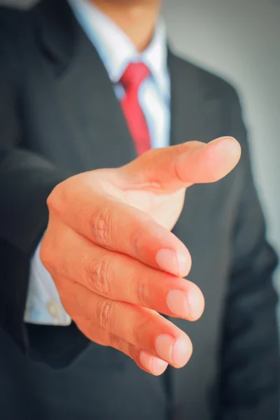 Hombre de negocios mostrando la mano sacudida signo — Foto de Stock