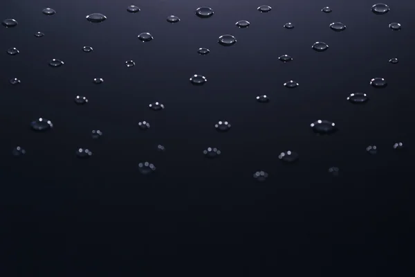 Le goccioline d'acqua isolate su uno sfondo scuro . — Foto Stock