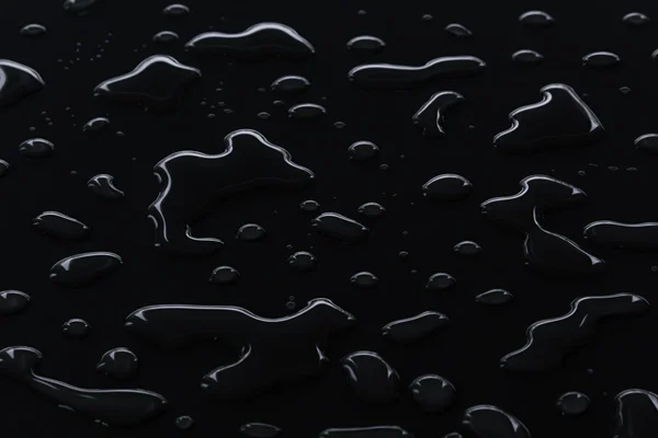 Las brillantes gotas de agua sobre un fondo negro . — Foto de Stock