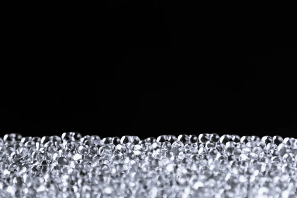 Minimalist abstract dark background with transparent glass particles. — Stock Photo, Image