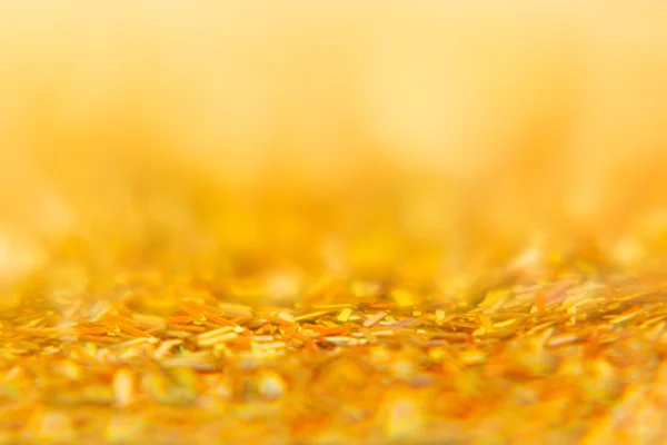 Abstracte gouden achtergrond met veelkleurige Glitters. Patroon. Achtergrond. — Stockfoto