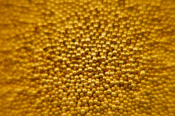 Zářivě zlaté pozadí abstraktní s zlaté kuličky. Pozadí. — Stock fotografie