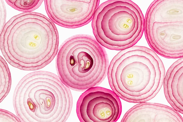 In Scheiben geschnittene rosa Zwiebel. Scheiben. Muster. Makro. Textur. Lebensmittel-Hintergrund. — Stockfoto