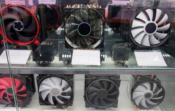 cooling fans for a computer processor on a glass shelf in a store. close-up.