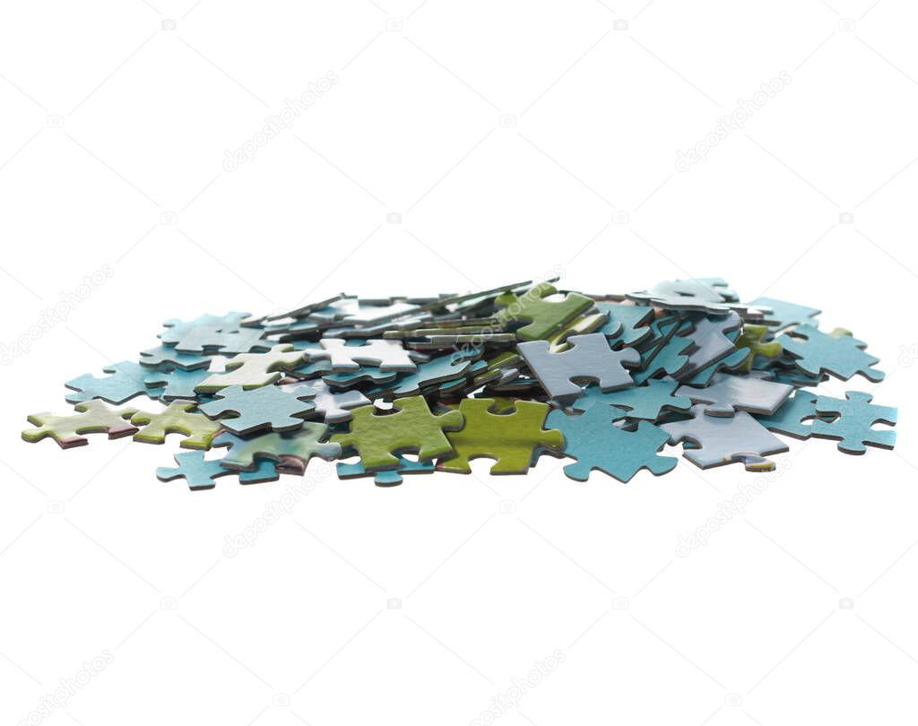 slide of displaced puzzles of different colors isolated on white background. copy space.