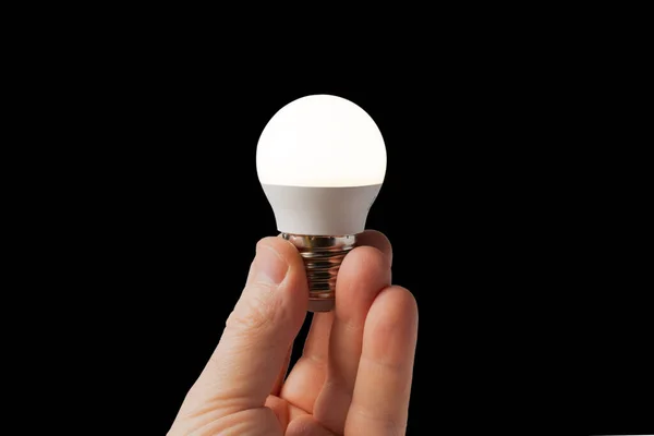Świecąca Lampa Led Rękach Człowieka Czarnym Tle Koncepcja Oszczędności Energii — Zdjęcie stockowe