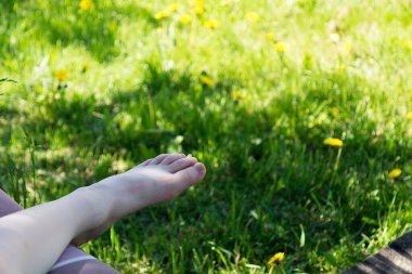 baby feet on a background of grass. copy space.
