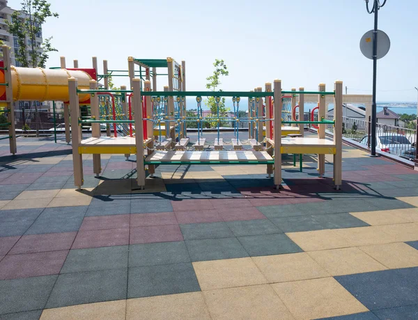 playground against the background of the sea and the morning blue sky. rest on the Black Sea coast with children. copy space.