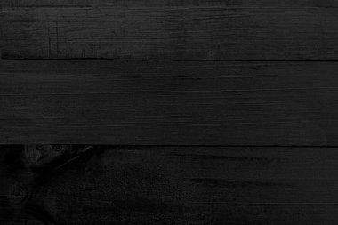 Güzel siyah ahşap döşeme, eserin daha ilginç görünmesi için tasarım ya da metin alanında bir arkaplan yapmak için mükemmeldir. Fantastik kopyalama alanı olan boşluk, siyah yüzey kavramı