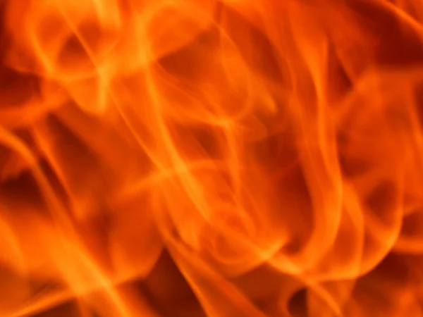 Die Textur einer Feuerflamme auf schwarzem Hintergrund — Stockfoto