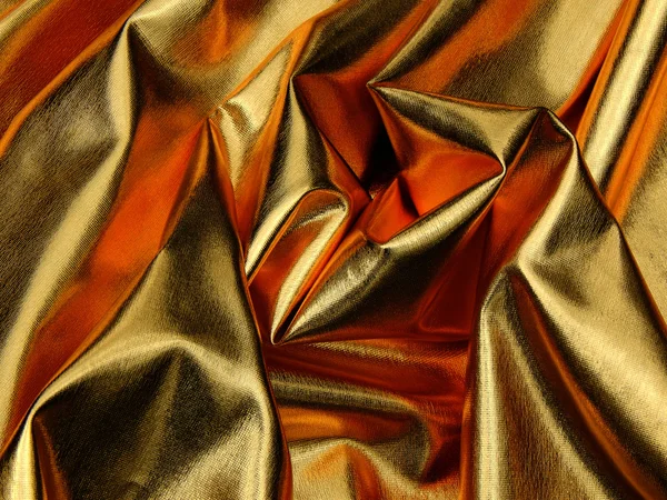 Textur des goldenen Materials Satin in Nahaufnahme — Stockfoto