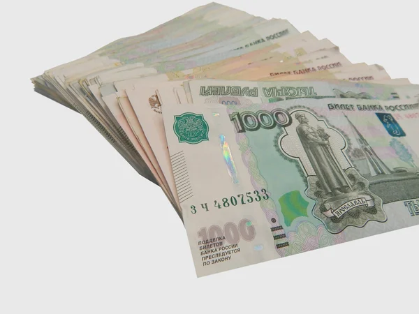 Una pila de dinero ruso en el primer plano 1000 y 100 — Foto de Stock
