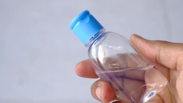 Close up of young man holding sanitizer gel — Stock Video