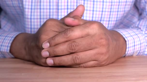Close up of young man hands on table — Stock Video