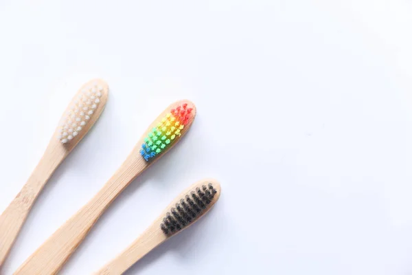 Colorful toothbrushes on white background with copy space — Stock Photo, Image