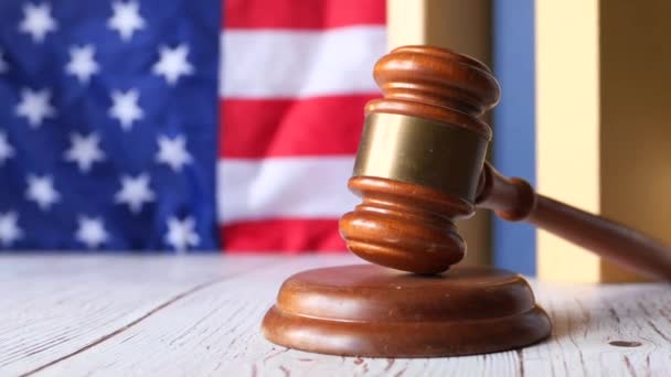 Closeup of gavel and book against american flag — Stock Video