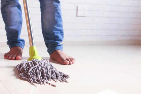 Cleaning tiles floor with mop — Stock Photo, Image