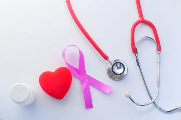 Red ribbon HIV, and stethoscope on white background. — Stock Photo, Image