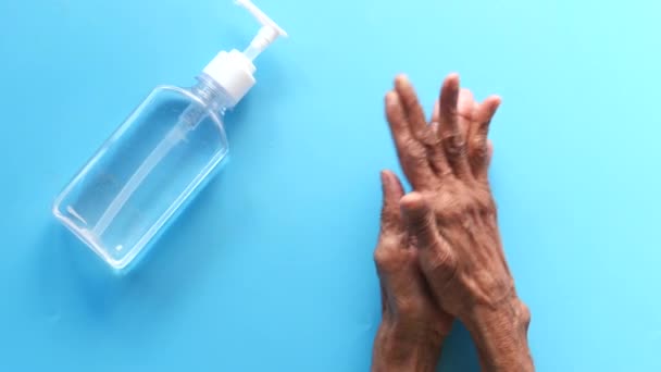 Close up of senior women hand using sanitizer gel for preventing virus — Stock Video