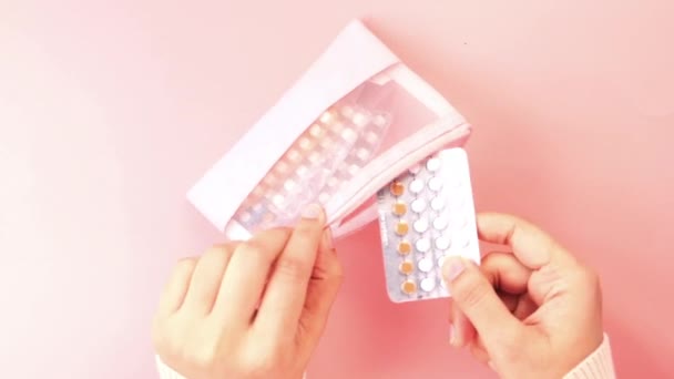 Women hand golding birth control pills close up — Stock Video