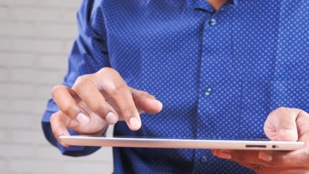 Man hand using digital tablet on black background — Stok Video