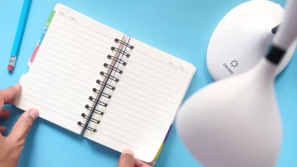 Close up of mans hand turning a pager of a diary — Stock Video