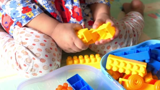 Child play with building blocks on bed close up — Stock Video