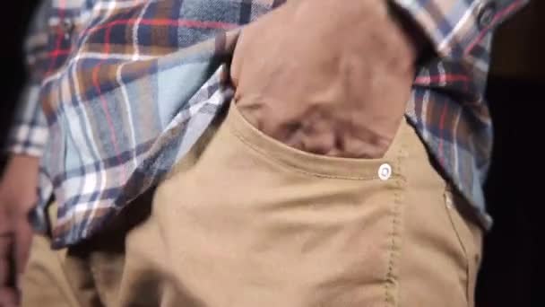 Young man shows empty pant pocket with copy space — Stock Video