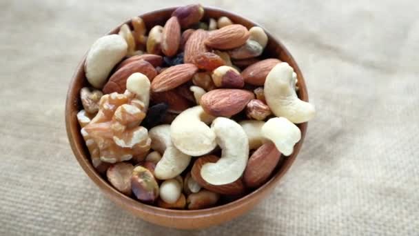 Close up of many mixed nuts — Stock Video