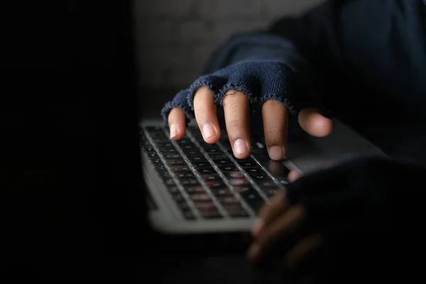 Hacker hand stealing data from laptop top down — Stock Photo, Image