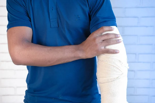 Injured painful hand with bandage — Stock Photo, Image