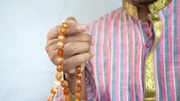 Muslim man keep hand in praying gestures during ramadan, Close up — Stock Video