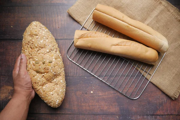 Top view of wheat brown baked bread on table — Stock Photo, Image