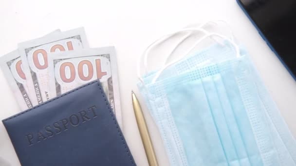 Protective mask, map and blue color passport on table — Stock Video