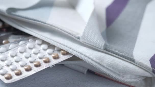Birth control pills on wooden background, close up — Stock Video