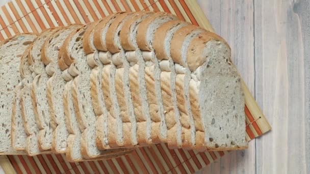 Close up of stack of baked bread on table — Stock video