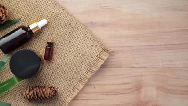 Eucalyptus essential oils in a glass bottle with green leaf on white background — Stock Video