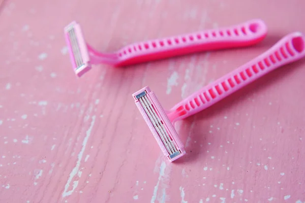 Close up of pink color razor on table , — Stock Photo, Image