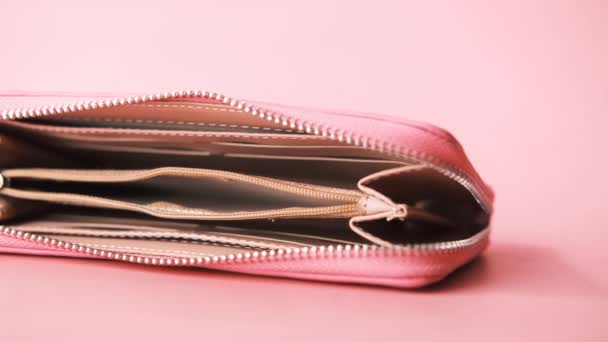 Empty wallet on pink background — Stock Video