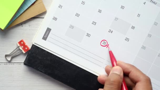 Escritura pagar deuda palabra en calendario — Vídeos de Stock