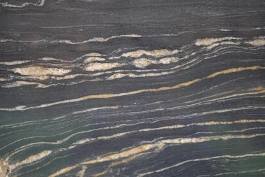 Renk ve doku katmanlarını gösteren güzel taş yüzey.