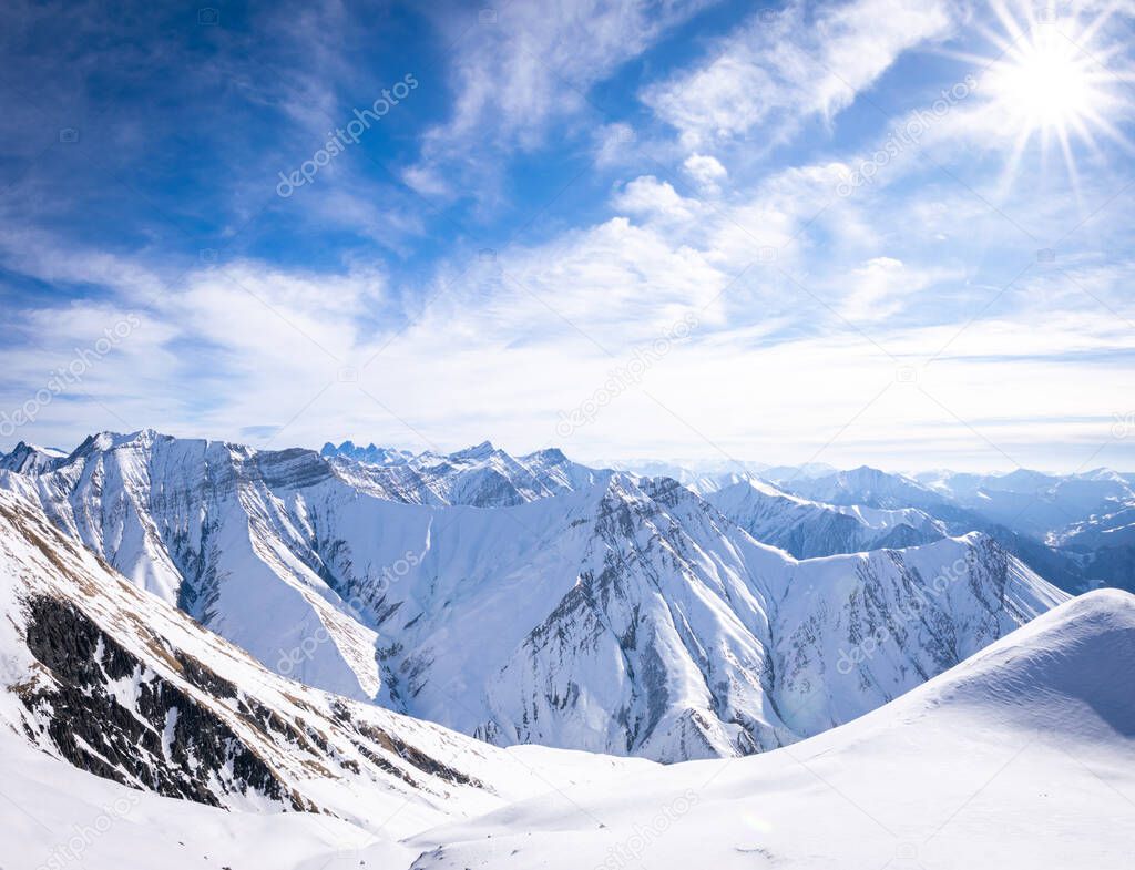 Gorgeous Panoramic view of white caucasus mountains in winter from high point in Gudauri ski resort.2020