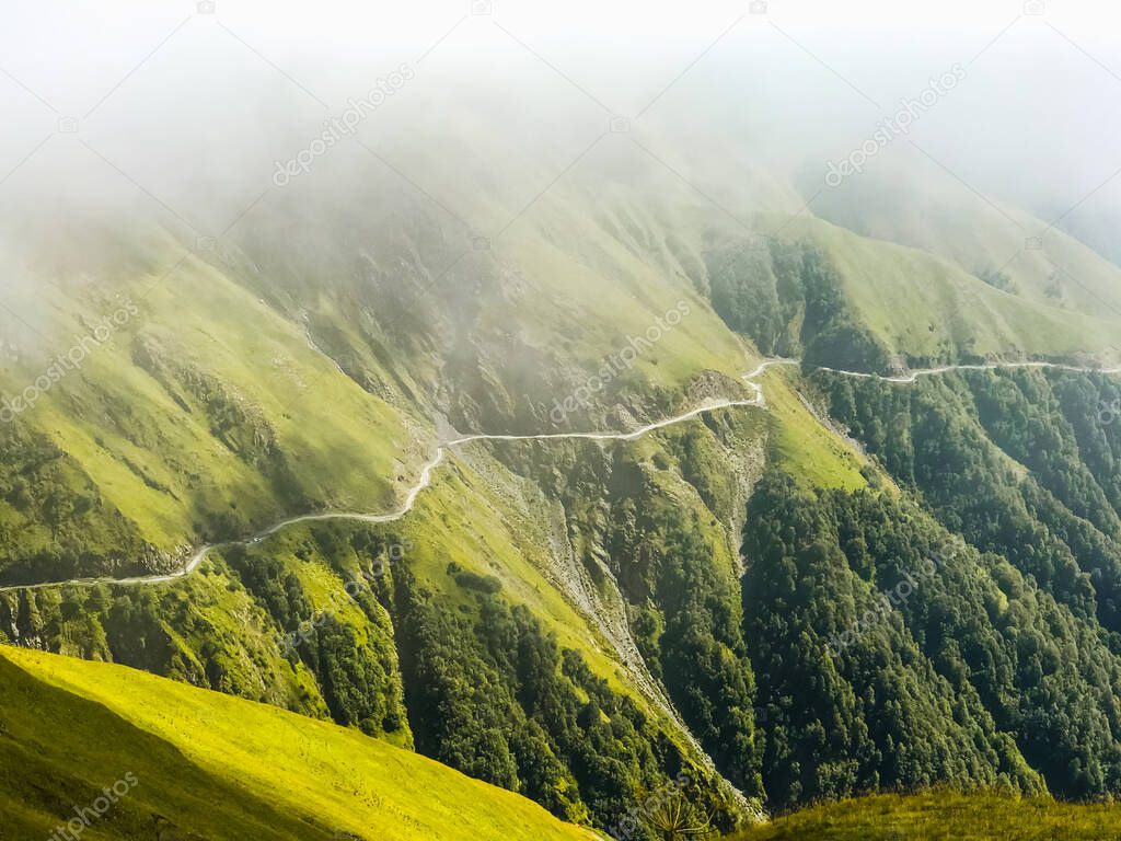 Serpentine highlands Tusheti road in caucasus.Georgia.The most dangerous roads in world concept.