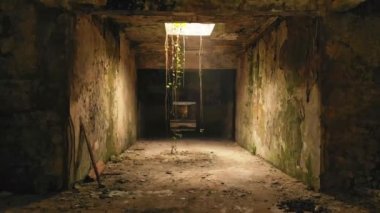 Old spooky passage way zoom out pov background. Walking inside vast, abandoned, building corridor.Backtracking drone dolly shot inside long corridor/hallway building.