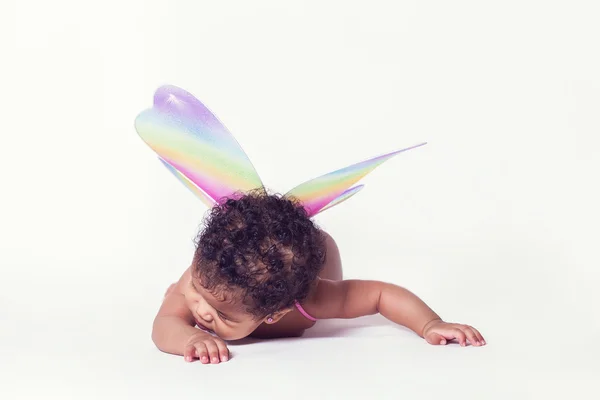 Pretty baby fairy wearing colorful wings — Stock Photo, Image