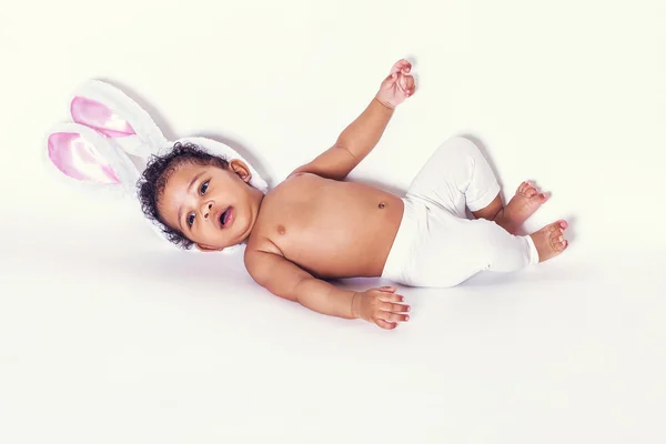 Lovely baby girl portrait lying and wearing bunny ears — Stock Photo, Image