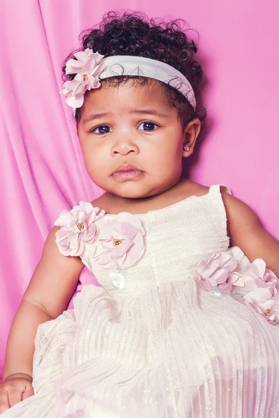 Cute baby girl portrait wearing floral dress — Stock Photo, Image