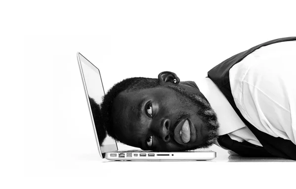 Exhausted african businessman portrait working at laptop black a — Stock Photo, Image