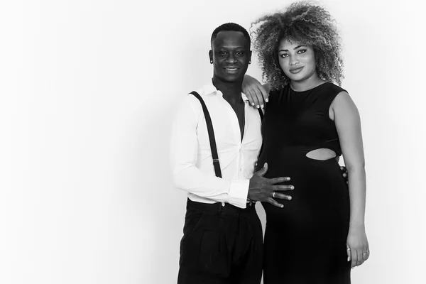 Elegant and happy couple portrait expecting baby black and white — Stock Photo, Image